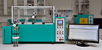 Stress relaxation test system for continuous measurement of rubber in either compression or tension